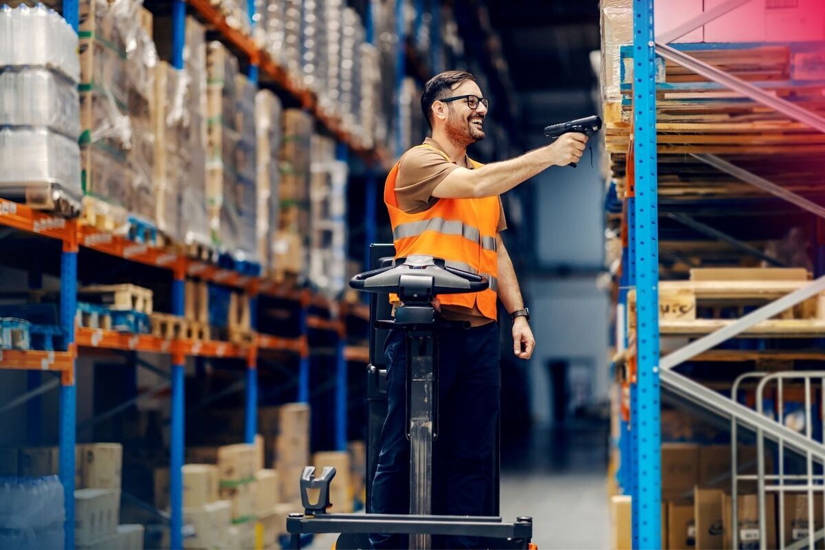 Warehouse worker scanning products during order picking to improve accuracy and reduce errors.