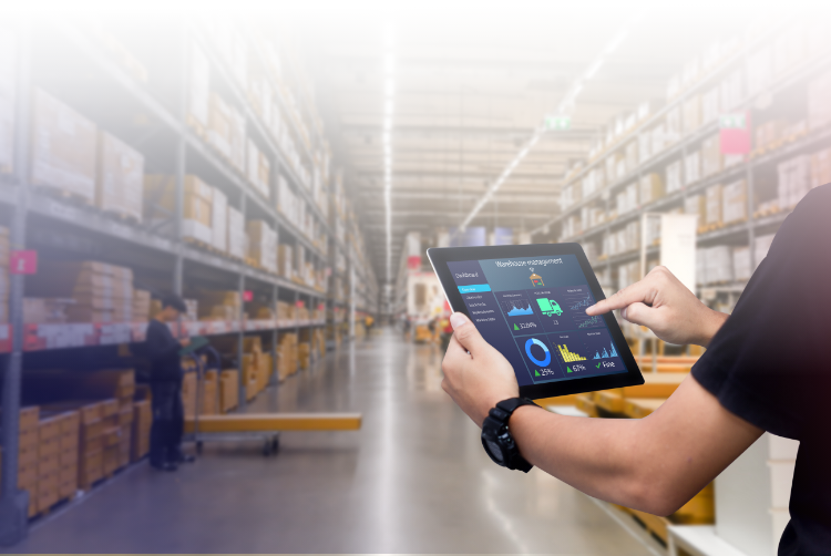 Hands holding screen tablet with a WMS software in a warehouse
