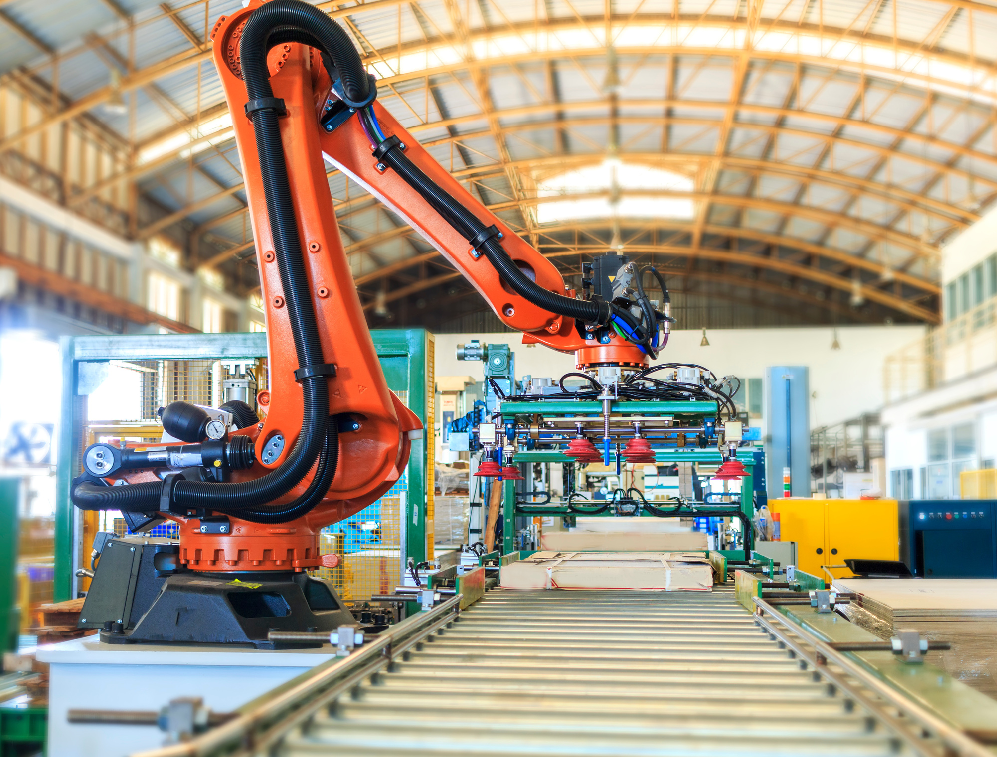 Types of warehouse automation using industrial robotics and conveyor systems for automated material handling.