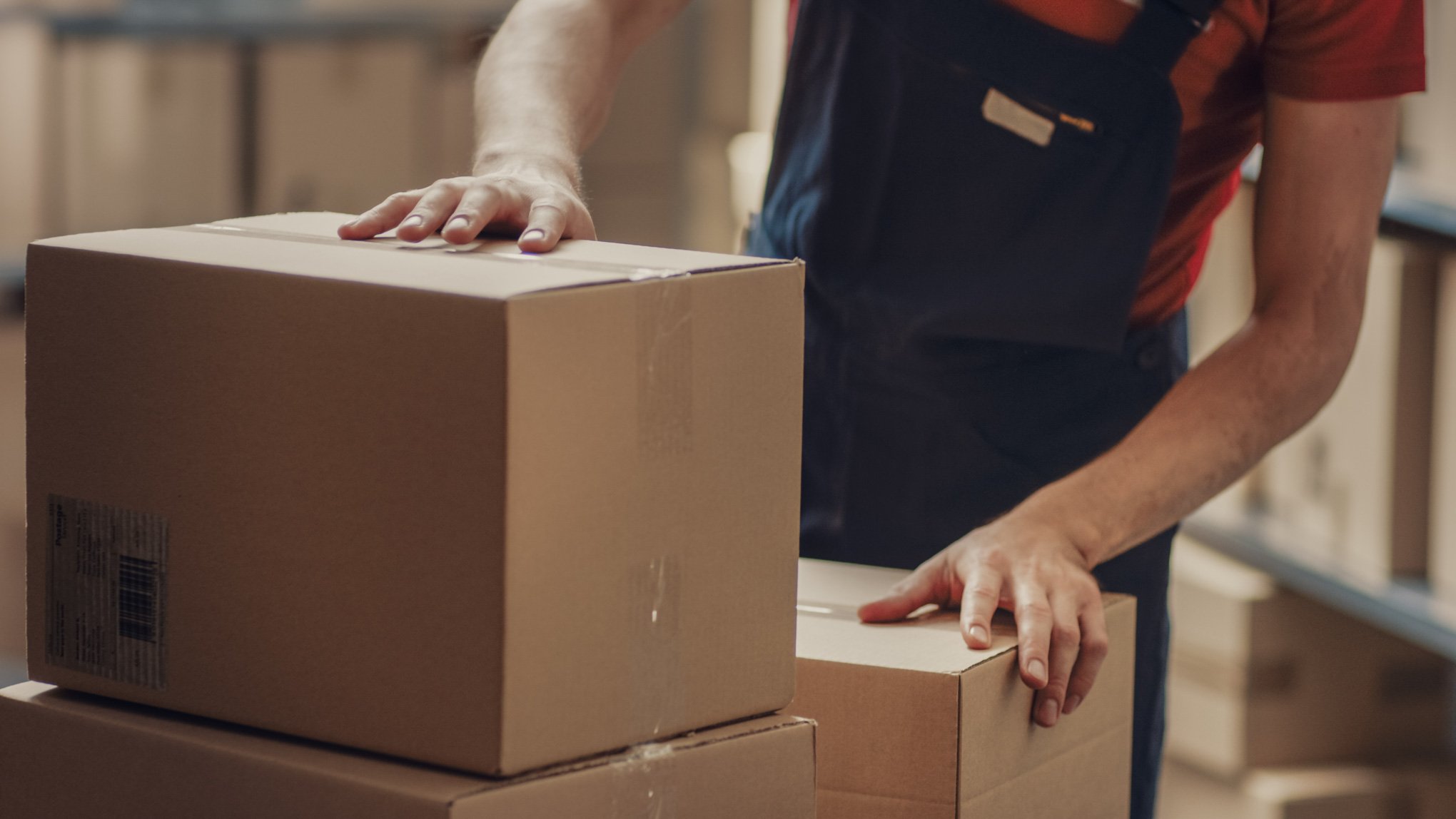 Warehouse worker collects parcels to improve  warehouse efficiency