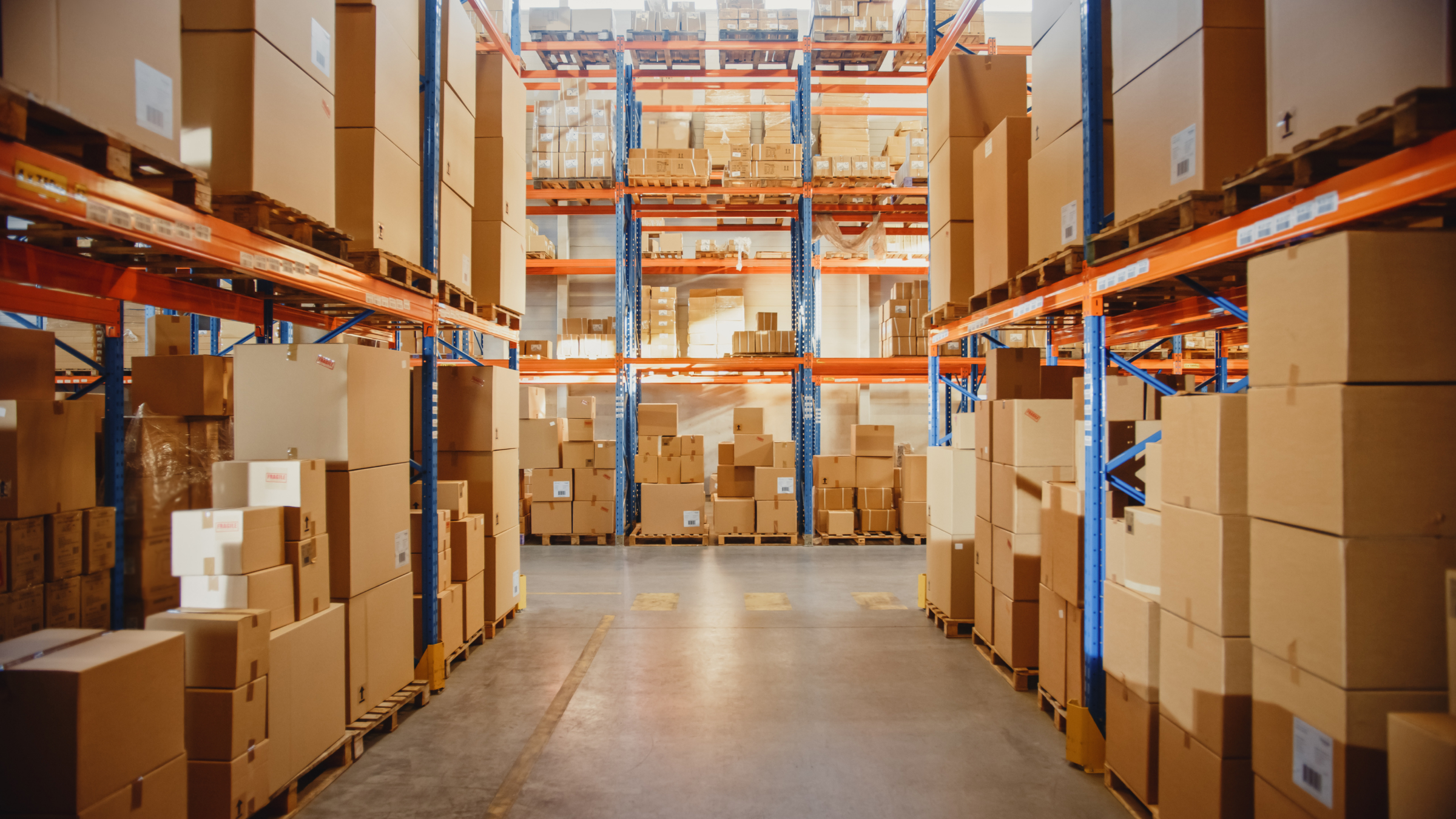 A Fulfillment Center full of shelves with goods in cardboard boxes and packages.