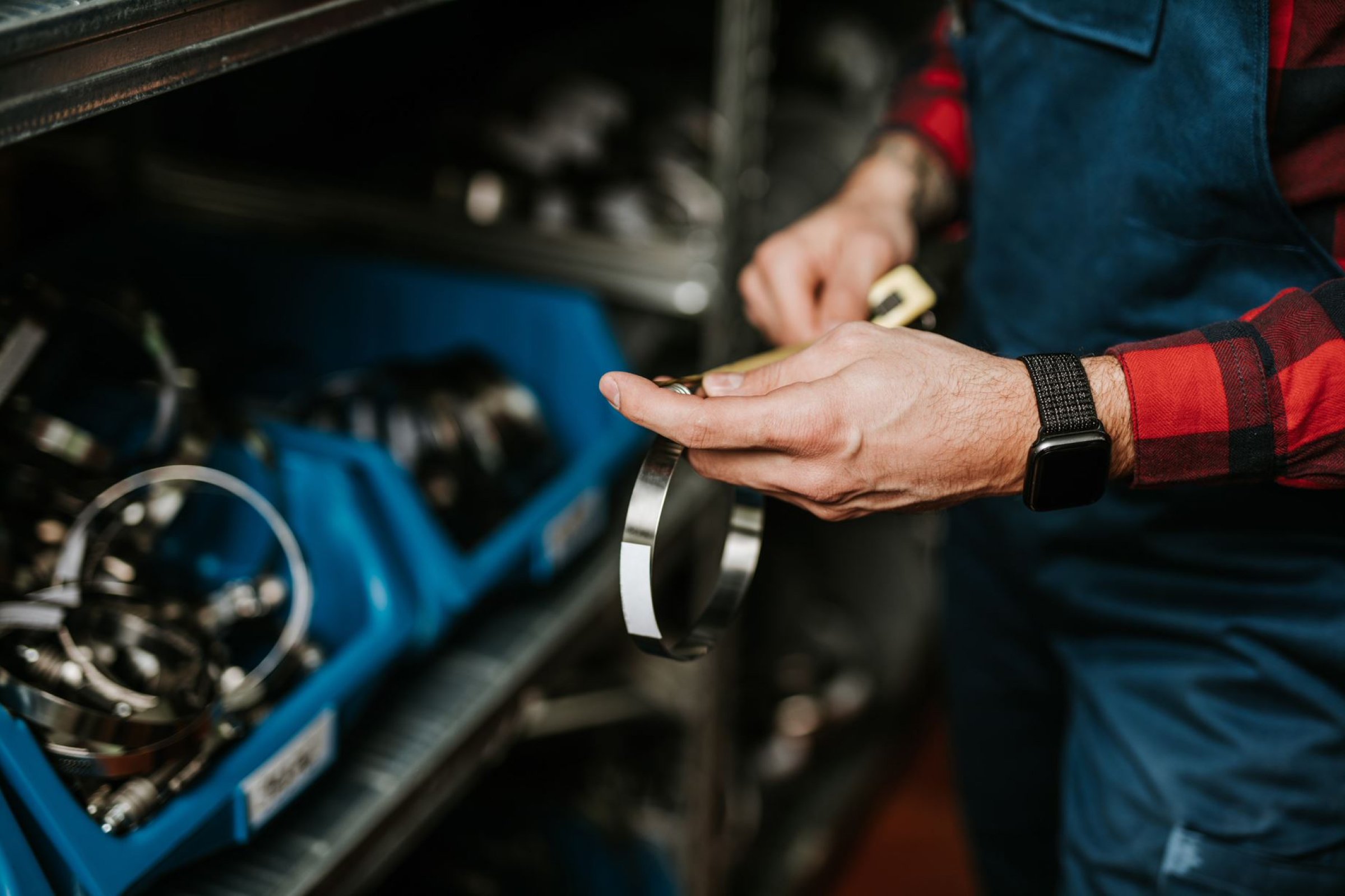  male hand holding a spare part